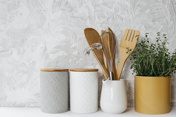 Kitchen utensils ceramic jar and thyme herb
