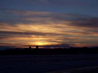 Rural Minnesota snowy fields at sunset 