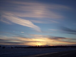Fototapeta na wymiar Rural Minnesota snowy fields at sunset 