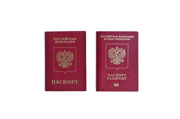 Two Russian passports lie next to each other on a white background
