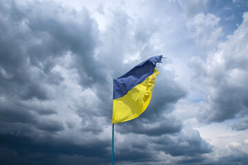 Ukrainian flag with cloudy sky background