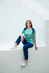 Fototapeta premium Medical student on the background of a school of nursing in a blue surgical suit. Young traumatologist doctor.