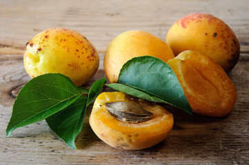 Fresh sweet apricots on the wooden table