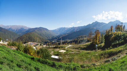 Fototapeta na wymiar Large panorama view of Rosa Khutor ski resort, year-round mountain resort near Sochi, Russia.