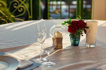 beautiful table setting, with dishes, food, in a summer cafe