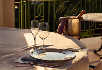 beautiful table setting, with dishes, food, in a summer cafe