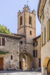 Fototapeta na wymiar St Pierre and St Paul Church tower and Ancient gate 'Nice' in Cagnes-sur-Mer. Cagnes-sur-Mer (between Nice and Cannes) - commune of Alpes-Maritimes department - Cote d'Azur region, France.