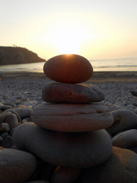 Stones In Perfect Balance On The Beach