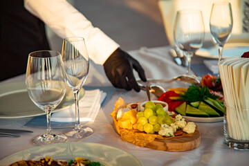 beautiful table setting, with dishes, food, in a summer cafe