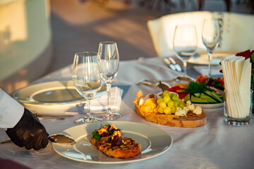 beautiful table setting, with dishes, food, in a summer cafe