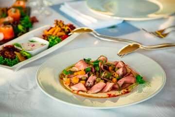 beautiful table setting, with dishes, food, in a summer cafe