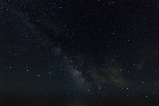 Heart of the Milky Way and stars overhead in the night sky