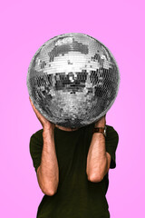 Man holds a disco ball. Mirror ball. Concept of a night club party, club life. Nightlife.