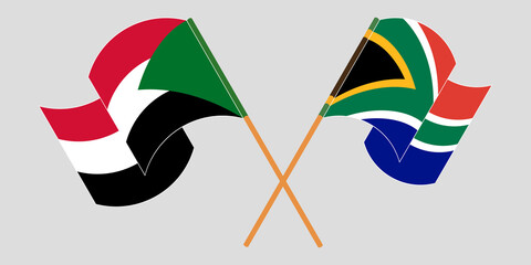 Crossed and waving flags of Sudan and Republic of South Africa