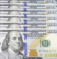 one hundred dollar bills clipped ladder
