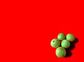 Yellow lemons on red background. healthy food concept