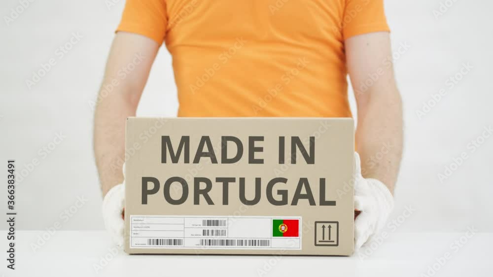 Poster box with made in portugal text being placed on the table