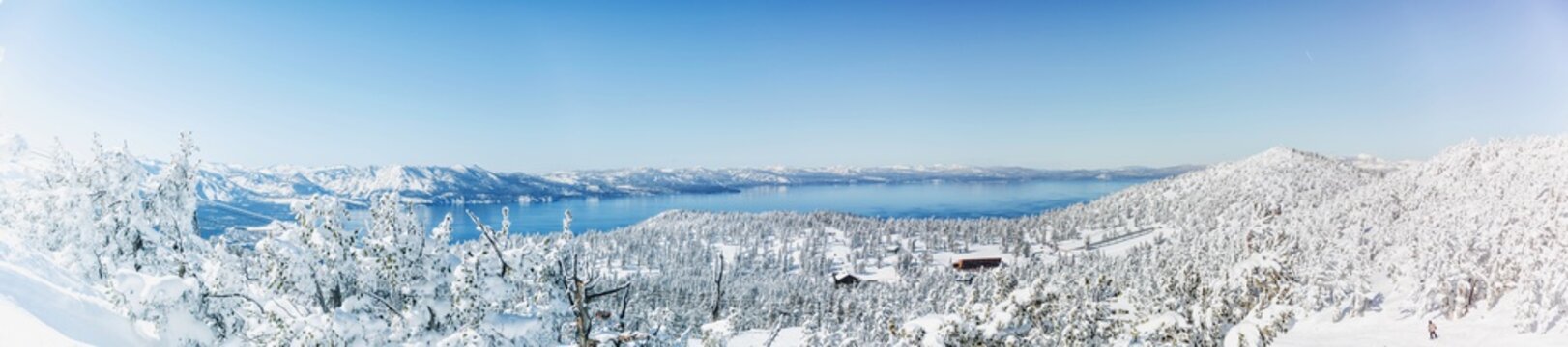 snowy panoramic view of ski resort on lake tahoe