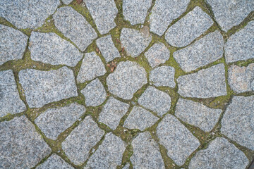 Circular stone pavement close-up detail. Traditional “Calçada Portuguesa”, from Portugal
