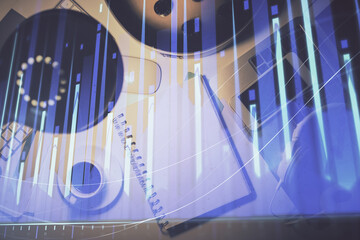 Multi exposure of forex chart drawing and work table top veiw. Concept of financial analysis.