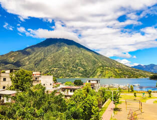Fototapeta na wymiar Blue Lake Atitlan surrounded by Volcanoes in Guatemala