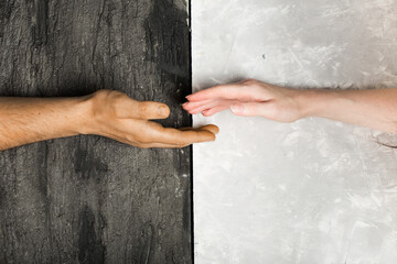 multi racial hand shake on black and white background. Stop racism concept