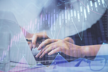 Multi exposure of woman hands typing on computer and financial graph hologram drawing. Stock market analysis concept.