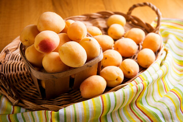 ripe sweet apricot on a wooden background