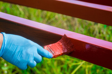 Protective coating of steel closed profiles with primer iron oxide red