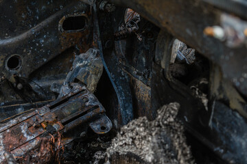 Charred remains of burned out car