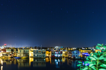 night in a small town with houses on the water