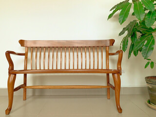 Wooden bench on a white background. Wooden bench in the wiating room. - obrazy, fototapety, plakaty