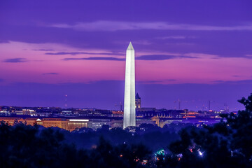 Washington Monument at sunrise with orange and purple clouds in the background Washington DC, USA