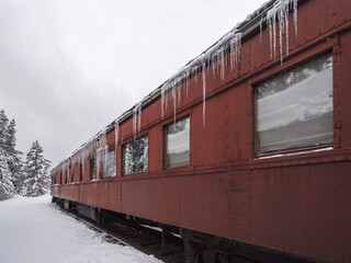Obraz premium icy red train parked in winter