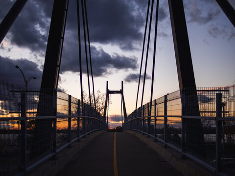 Low Angle View Of The Shadow Of A Suspension Bridge On A Sunset In Summer