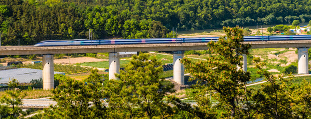 High speed train in rural countryside.