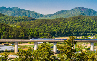 High speed train in rural countryside.