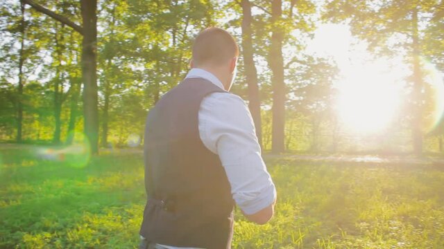 young man violinist in the nature playing the violin classic