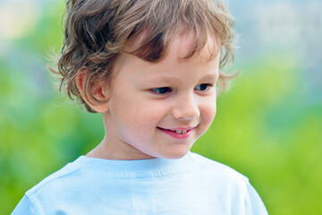 Child has summer joy. International childrens day. Closeup of cute young boy. Portrait of little boy posing outside. Close-up portrait of a happy boy. Funny little boy. Close-up. Carefree child.