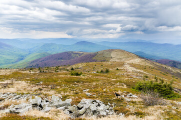 Carpathian mountains on the territory of Ukraine. Spring, Summer and Autumn in the Mountains. Mountain ranges and peaks. Sky and clouds. Ruins and rocks.