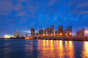 Fototapeta na wymiar City of Miami Florida skyline and bay with night clouds. Miami city night.