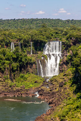 Forest, waterfalls and river with rocks