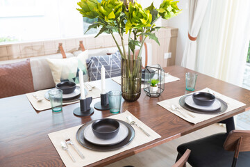 Wooden table and chair in modern dinning room at home. Interior of dinning room at home.