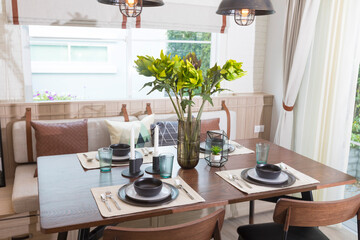 Wooden table and chair in modern dinning room at home. Interior of dinning room at home.