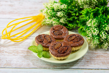 chocolate tart brownies with raisin on green dish