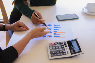 solf focus hand team business  Brainstorming meeting for data with analyzing charts at his workplace.concept