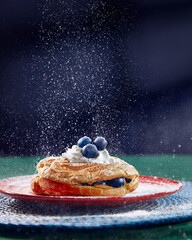 Blueberry cream pastry with icing sugar