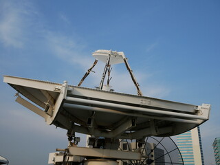 Satellite dish in the sky at TV station.