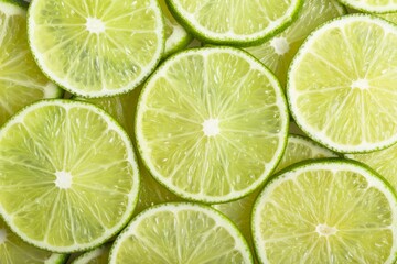 Fototapeta na wymiar Close-Up of Slices of Limes
