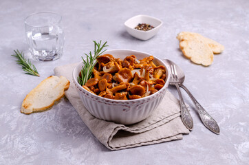 Fried chanterelle mushrooms with onions and rosemary